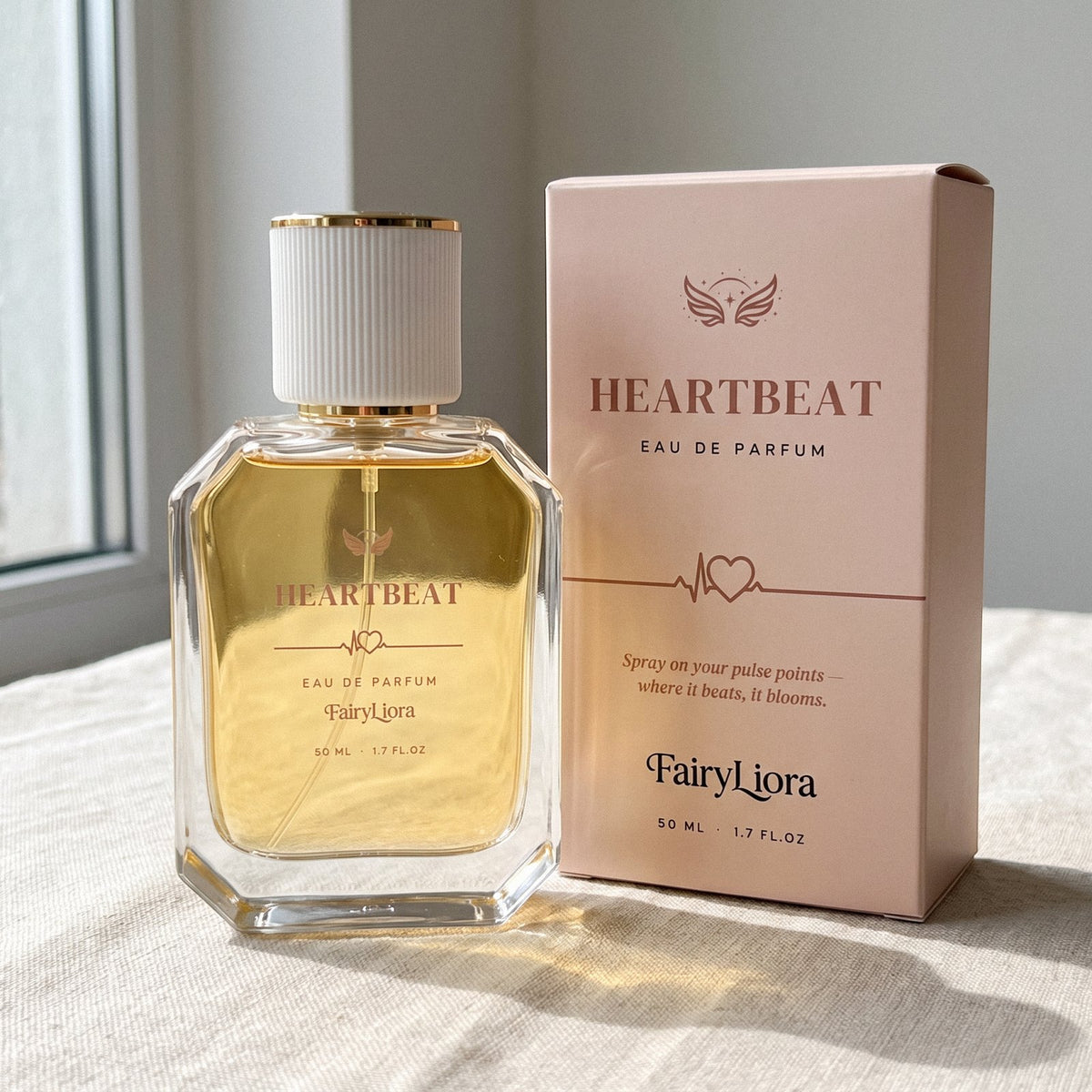 Heartbeat perfume beside its blush gift box