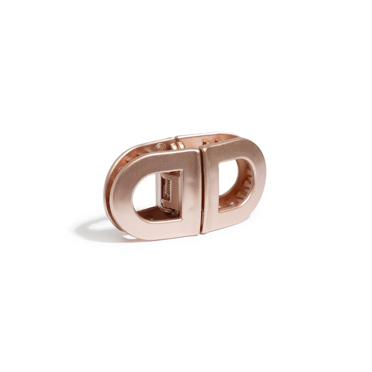 Blush rose-gold clips snapped together