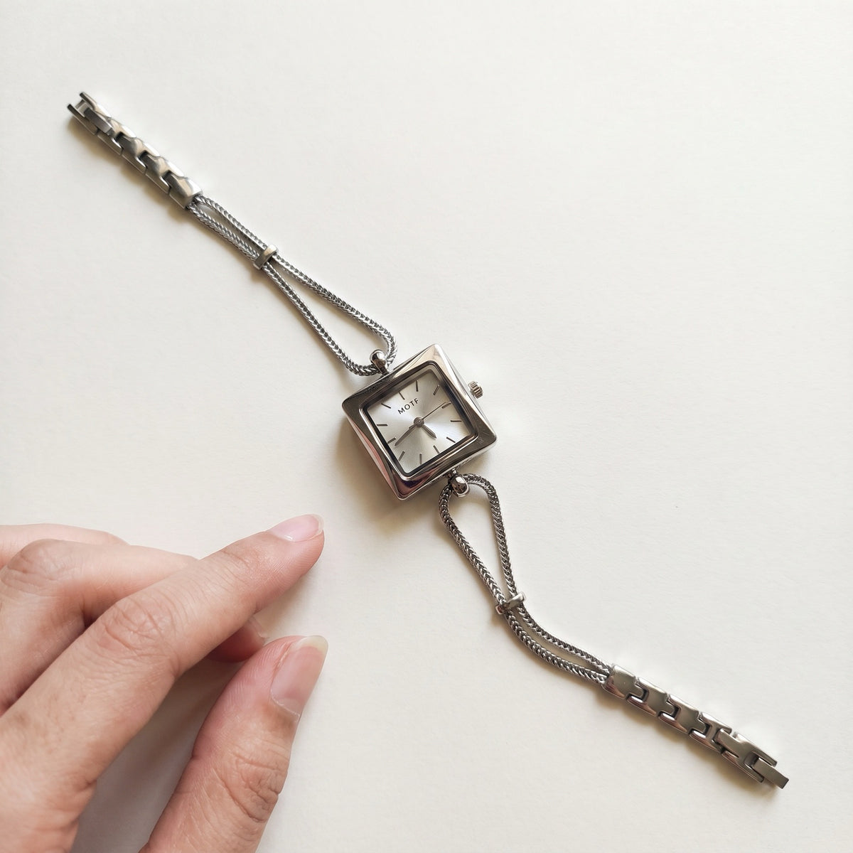 Queen's Watch flat lay showing double chain, slider beads and clasp