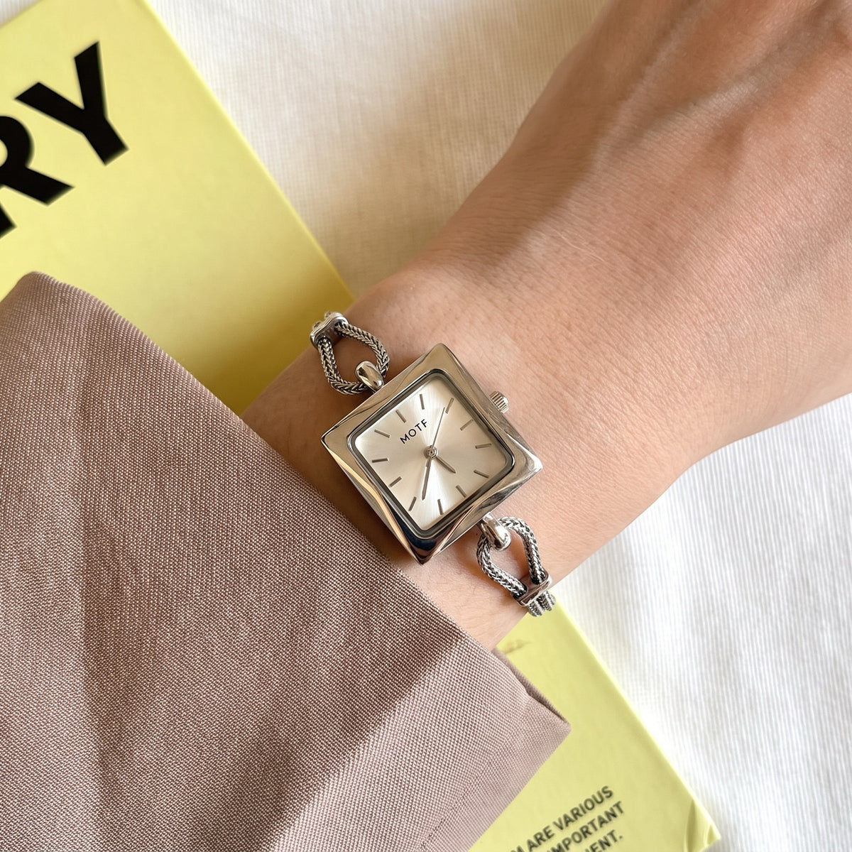 Queen's Watch worn under a sleeve